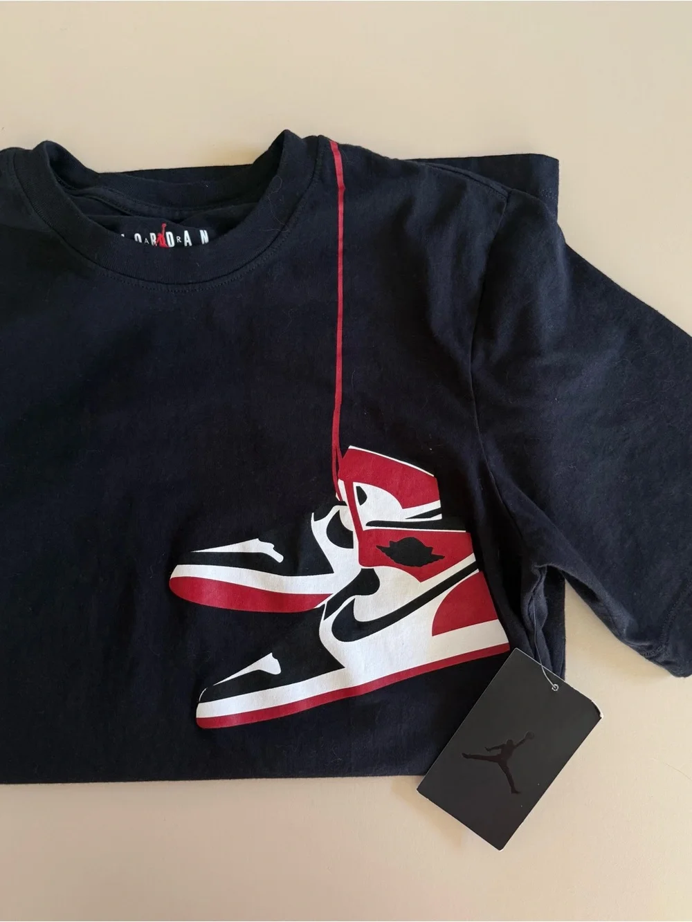 Jordan Men’s Black T‑Shirt with Red and White Sneaker Graphic